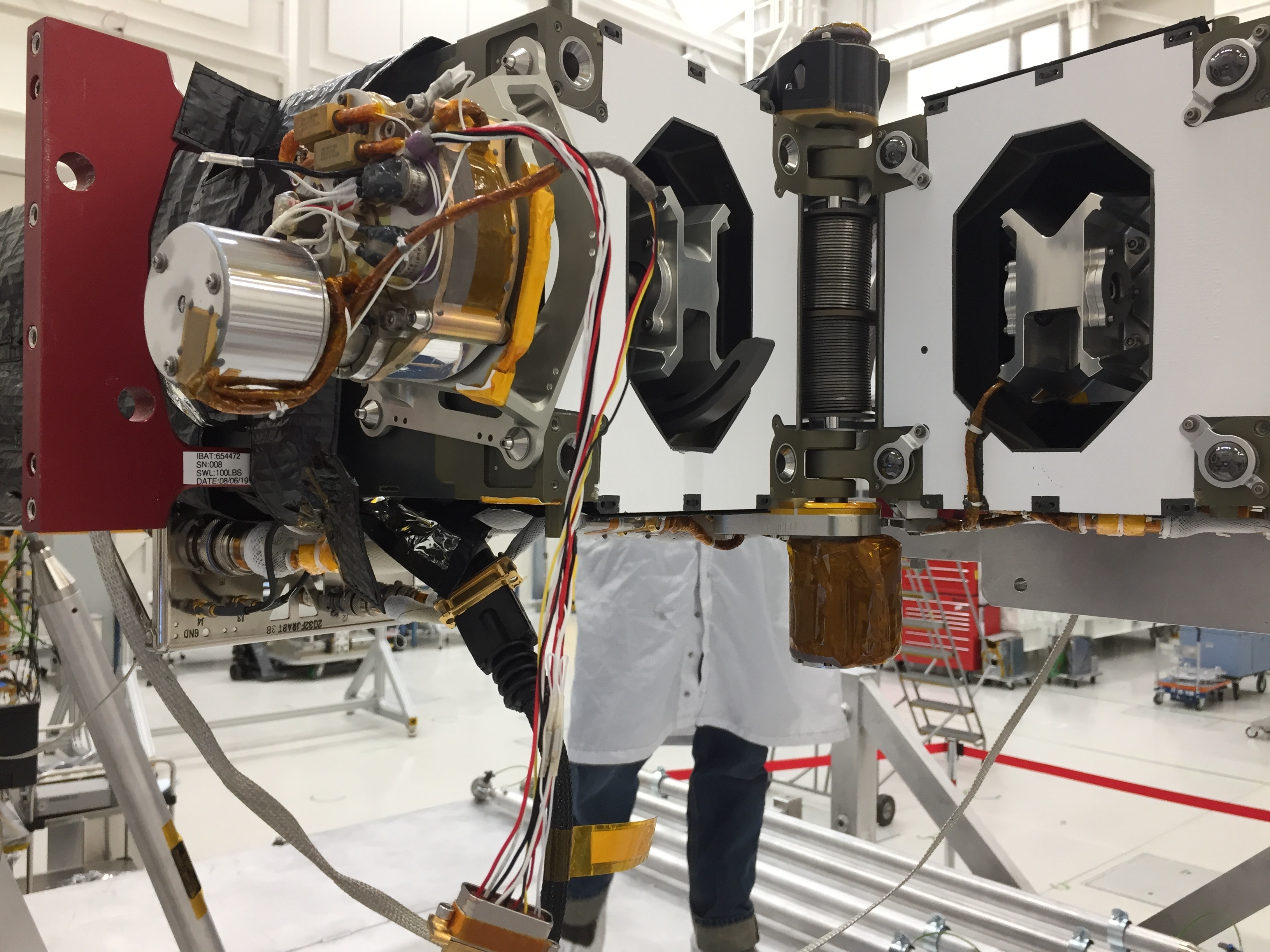 Testing the NISAR antenna boom's hinge and latching actuator at NASA's Jet Propulsion Laboratory.